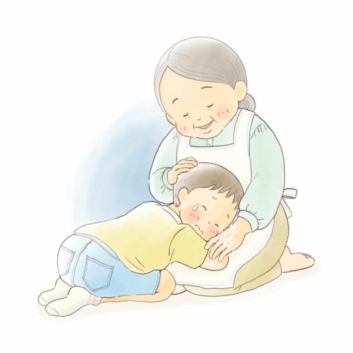 おばあちゃんの膝に泣きつく主人公
