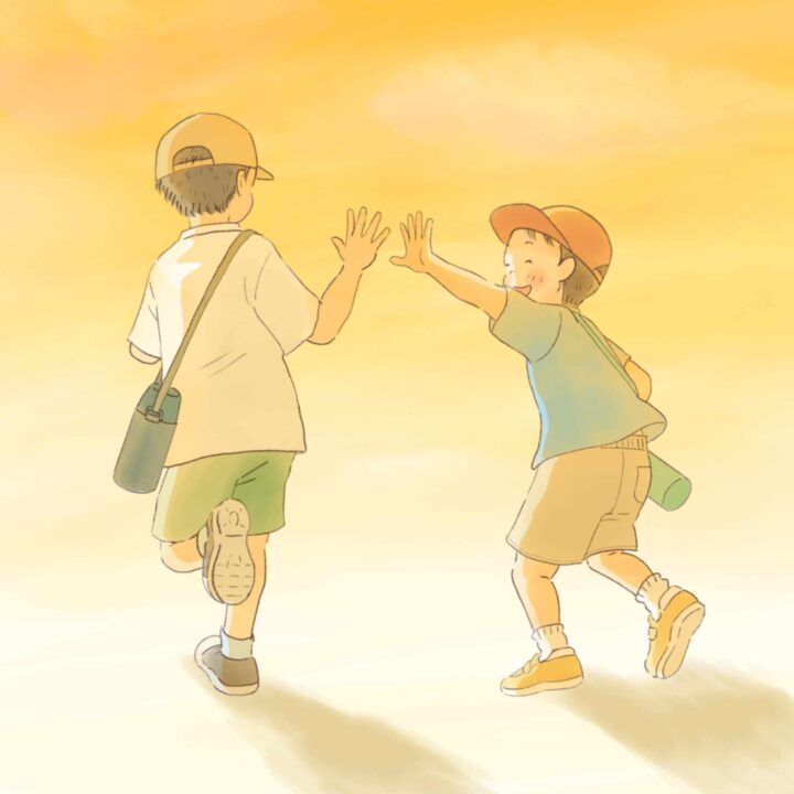 夕方にバイバイする小学生