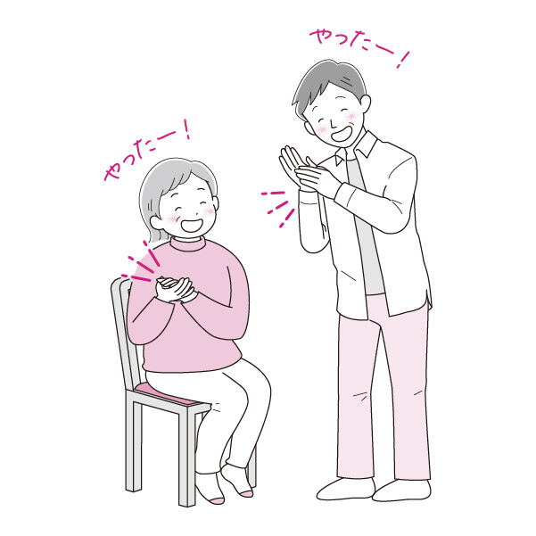 手を叩いて笑う男女